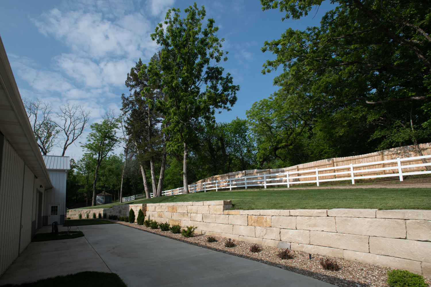 Morton Building retaining wall at Hidden Timber Farm horse pasture boarding